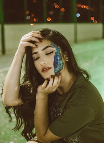 Close-Up Photo Of Woman With Face Paint