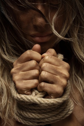 Close-Up Photo of Woman With Her Hands Tied With Rope