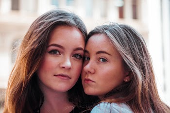 Close-Up Photo of Women Close To Each Other