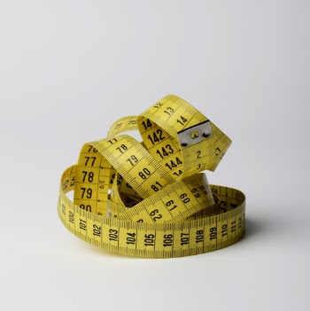 Close-Up Photo of Yellow Tape Measure