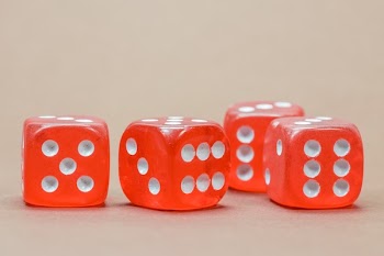 Close Up Photography of 4 Red White Dice