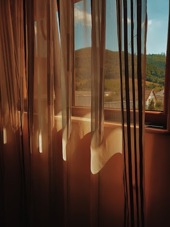 Close-up Photography of a Brown Curtain