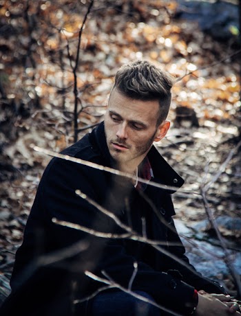 Close-Up Photography of a Man Wearing Black Coat