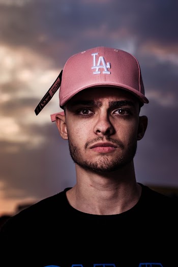 Close-up Photography of a Man Wearing Red Cap 