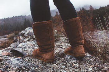 Close-Up Photography of a Person Wearing Brown Winter Boots