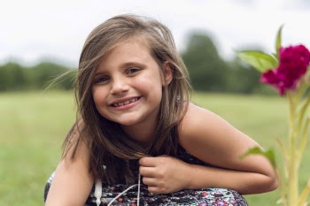Close-up Photography of a Smiling Girl