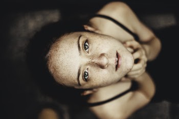 Close-Up Photography of a Woman Looking Up