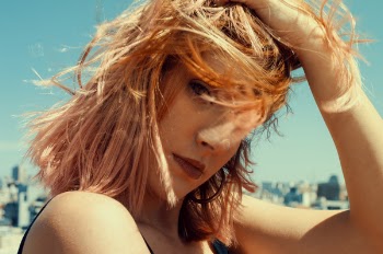 Close-up Photography of a Woman Touching Her Hair