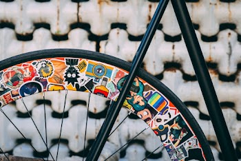 Close Up Photography of Bicycle Near Wall