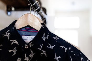 close-up photography of black and white collared top