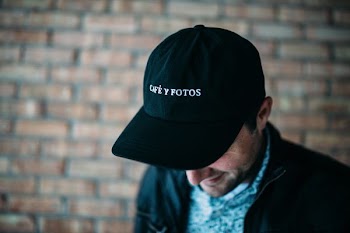 close-up photography of black fitted cap