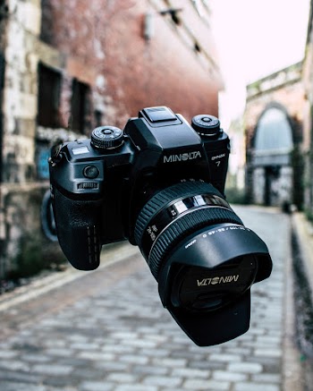 Close-Up Photography of Black Minolta DSLR Camera