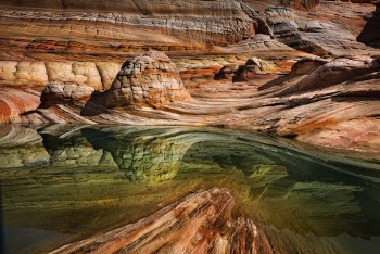 Close-up Photography of Body of Water and Rock Formation