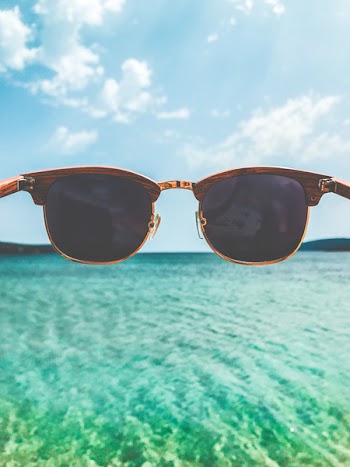 Close Up Photography of Brown Clubmaster Style Sunglasses
