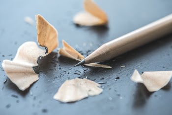 Close-up Photography of Brown Pencil With Pencil Shavings on Table