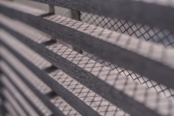 Close-up Photography of Brown Window Grills