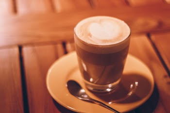 Close-up Photography of Clear Glass Cup With Latte and Tablespoon