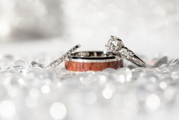 Close Up Photography Of Engagement Ring And Wedding Rings