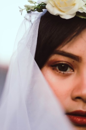 Close-up Photography of Girl Wearing White a Veil