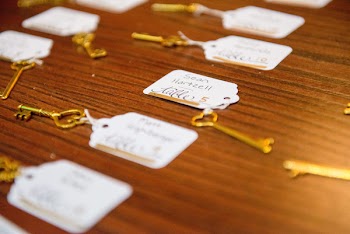 Close-up Photography of Gold-colored Skeleton Keys on Brown Wooden Surface