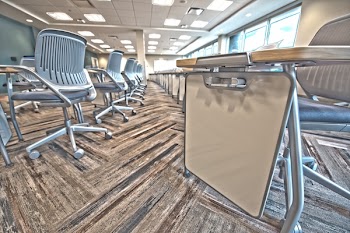 Close-up Photography of Gray Metal Rolling Chair Inside Room