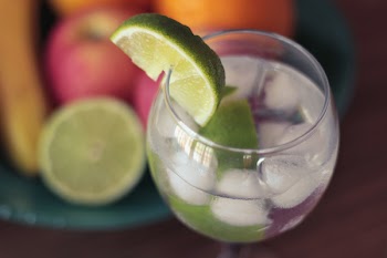 Close-up Photography of Green Sliced Lime on Clear Glass Cup