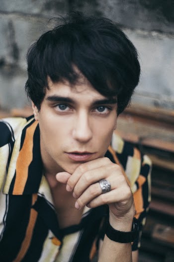 Close-up Photography of Man Wearing Black-yellow-and-orange Striped Button-up Shirt
