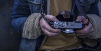 Close-up Photography of Person Holding Camera