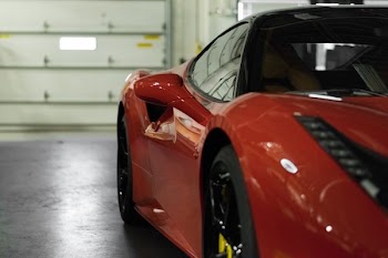 close-up photography of red coupe