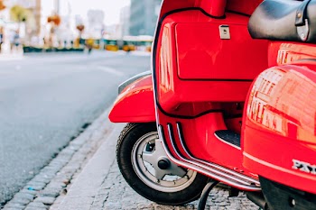 Close-Up Photography of Red Scooter