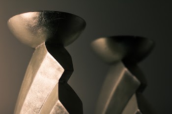 Close-up Photography of Two Brass-colored Candle Holders