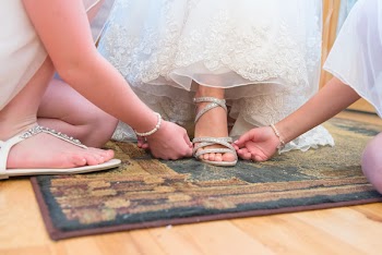 Close-up Photography of Two Person With the Bride 