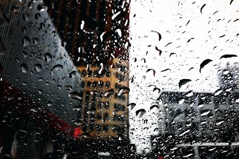 Close-up Photography of Water Droplets on Clear Glass