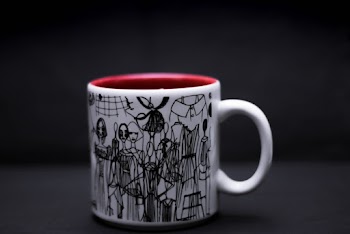 Close-up Photography of White and Black Ceramic Mug 