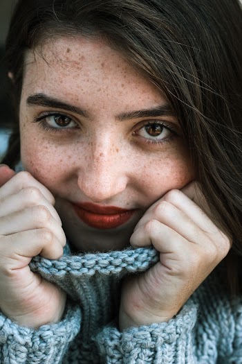Close-Up Photography Of Woman In Knitted Sweater