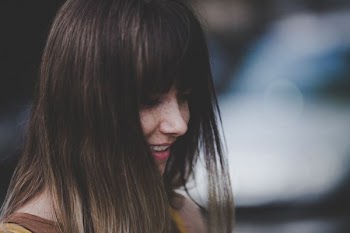 close-up photography of woman smiling
