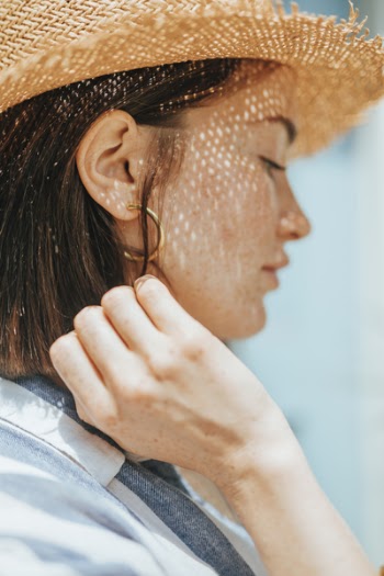 Close Up Photography of Woman Wearing Blue Collared Shirt