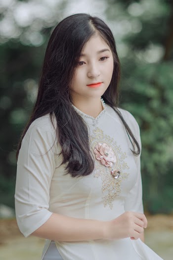 Close-Up Photography of Woman Wearing White Dress