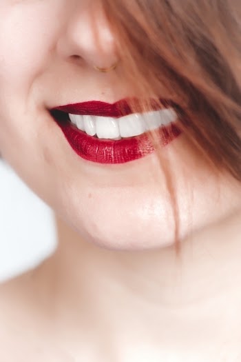Close Up Photography of Woman With Red Lips