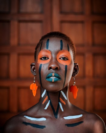 Close-up Photography of Woman With Tribal Face Paint