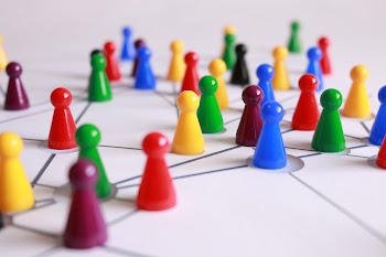 Close Up Photography of Yellow Green Red and Brown Plastic Cones on White Lined Surface · Free Stock Photo