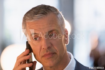 Close up portrait corporate businessman talking on smart phone