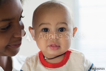 Close up portrait cute baby boy with mother
