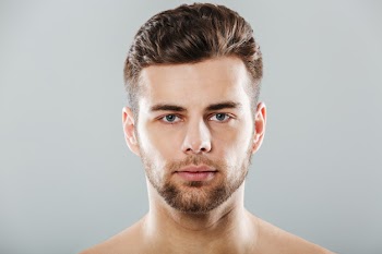 Close up portrait of a young bearded man face Free Photo