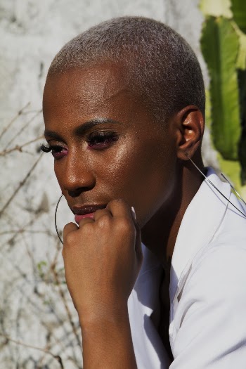 Close-up Portrait Photo of Woman in White Collared Top Posing