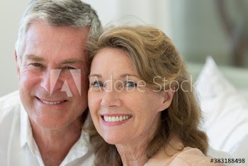 Close up portrait smiling senior couple
