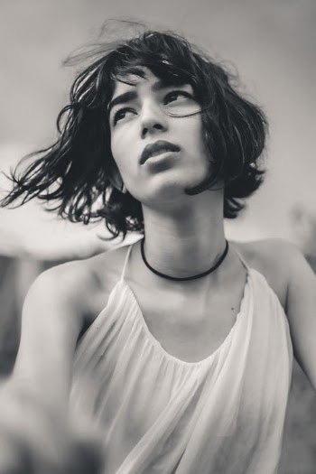 Close-Up Shot of a Woman in a White Tank Top · Free Stock Photo