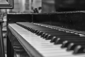 Close Up Shot of Upright Piano Grayscale Photo