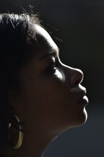 Close-up Side View Photo of Woman in Gold-colored Hoop Earring