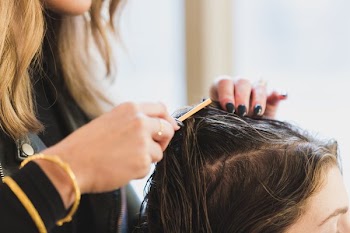 Close Up Stylist Parting Hair